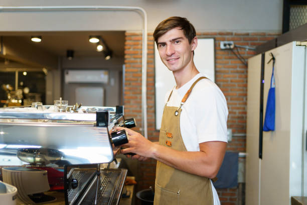 istock Barista in coffee shop. 1924280399