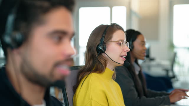 Diverse young people working in customer service call cente
