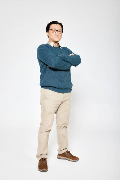 istock businessman posing standing with folded arms 1924353633