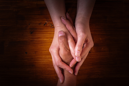 men and women holding hands