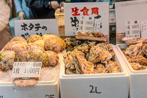 Merchants sell seafood at Tsukiji Fish Market in Tokyo. It is the biggest wholesale fish and seafood market in the world.