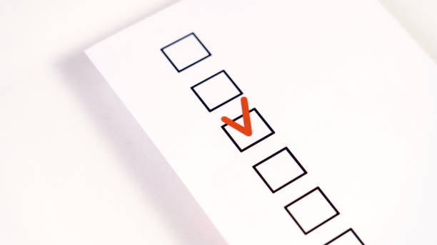 istock A form with a checkbox for selection and a red checkmark, a concept of choice, Checkbox with red Check mark, red check mark on paper, Agree, check boxes on white sheet. Red check mark 1924370179
