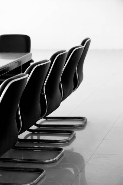 Conference table and chairs in empty meeting room