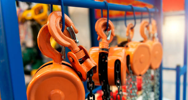 istock Group of lifting hooks equipment with chains 1924377177