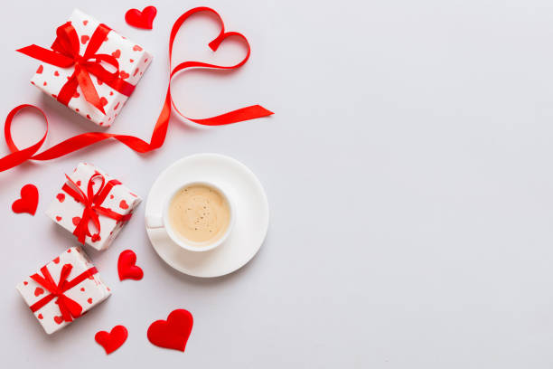 istock Mug coffee and gift box on colored background. Flat lay composition. Holiday concept 1924386862