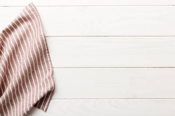 istock top view with red empty kitchen napkin isolated on table background. Folded cloth for mockup with copy space, Flat lay. Minimal style 1924387441