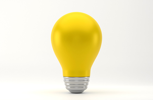 Yellow Light Bulb On White Background