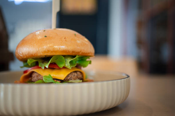 istock Delicious burger with vegetables, pork and cheese 1924413229