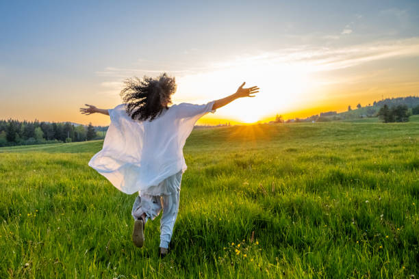 Woman walking in meadow