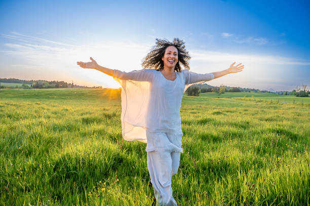 istock Woman walking in meadow 1924431011