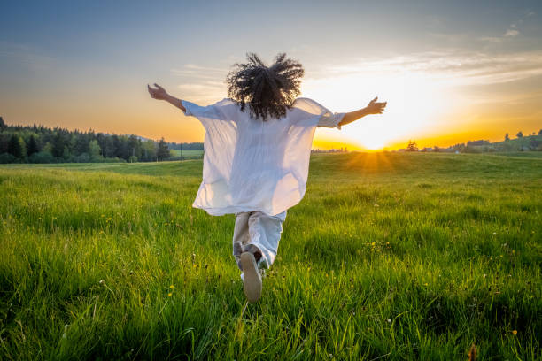 istock Woman walking in meadow 1924431033