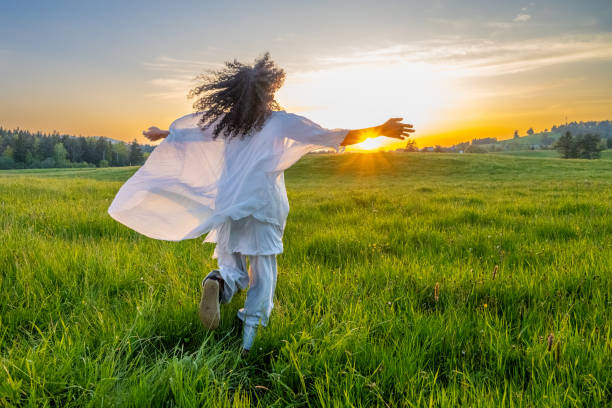 istock Woman walking in meadow 1924431040