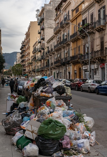 Palermo, Italy - 5 January, 2024: heaps of garbage and trash in the streets of downtown Palermo in Sicily