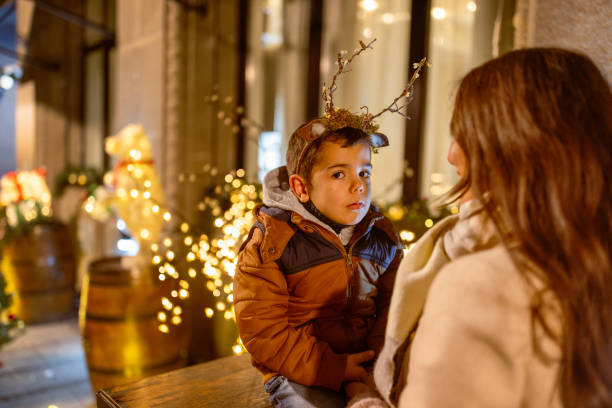 istock Mother and son outdoor. It's a Christmas time 1924463984