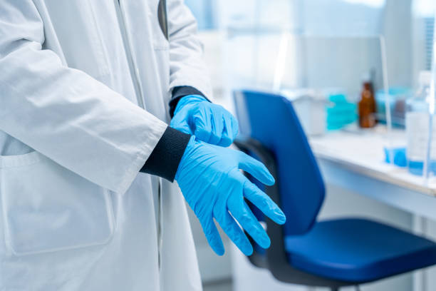 istock Doctor wearing protective latex globes in a laboratory 1924465642