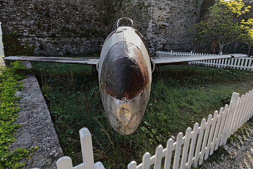Old U.S. military Lockheed T-33 Shooting Star airplane landed and abandoned in Tirana airport in 1957, since 1970 on display at the top of the citadel as part of the Arms Exhibit. Gjirokaster-Albania.