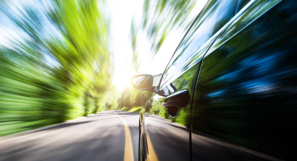 istock Car in motion blur driving to forest 1924480354