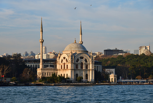 Istanbul, Turkey. Dolmabahce Mosque is a baroque waterside mosque in Kabatas in the Beyoglu district of Istanbul. View from Bosphorus