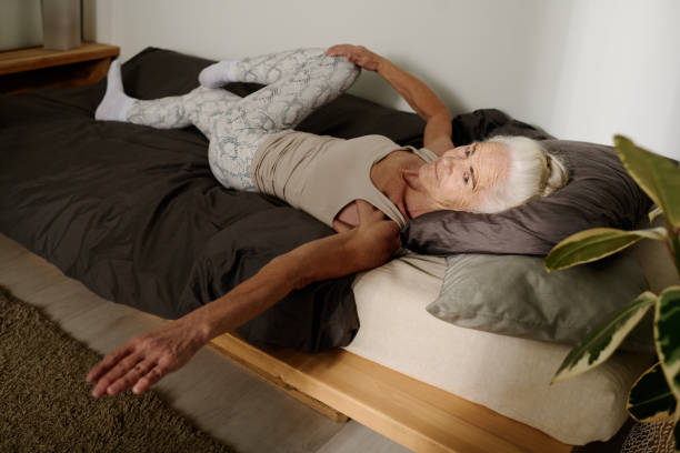 istock Woman exercising on bed after sleep 1924522902