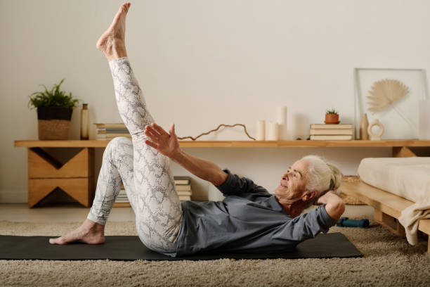 istock Woman stretching arm towards raised leg 1924523956