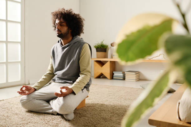 istock Calm guy meditating on the floor 1924524496