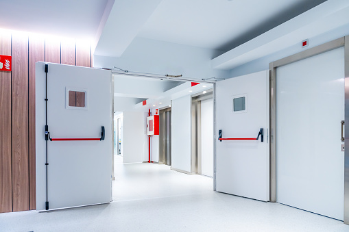 Opened doors of the emergency area of an hospital with no people