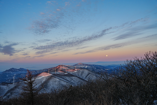 snow mountain range with moon