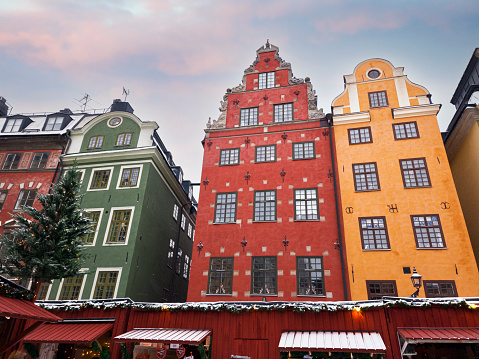 Colourful buildings with christmas markets at the Stortorget  square in the winter scenery, Gamla Stan, Stockolm, Sweden, Scandianvia