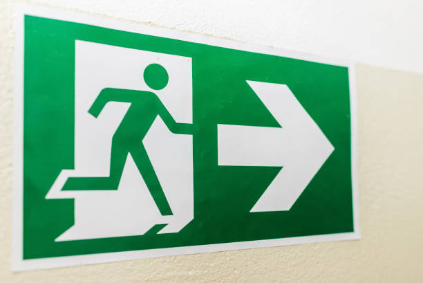 istock Green sign of strange escape way.Fire exit light sign.fire.Close up. 1924570020