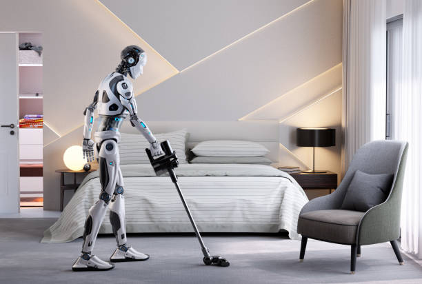 Robot assistant vacuuming stock photo