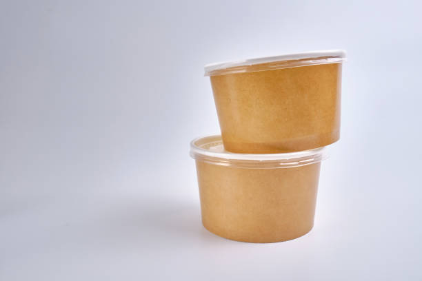 istock Kraft paper tableware: cups, food boxes, isolated on a light background. A set of various disposable tableware. Recycling and zero waste concept. Mock up 1924628040