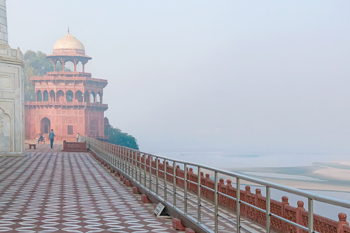Masjid of Taj Mahal complex. Scenic view before sunrise, with mist over Yamuna (Jamune) river. Agra, Uttar Pradesh, India