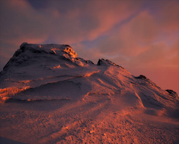 Snow mountain at sunset with some clouds in the sky.