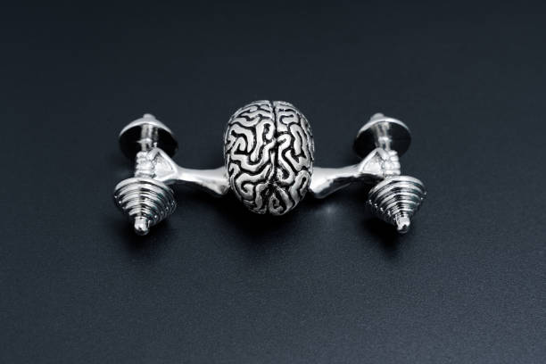 istock Human Brain with Arms Lifting Heavy Dumbbells 1924642643