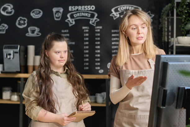 istock Girl with disability working in cafe 1924643715