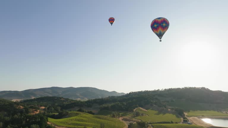 Three Hot Air Balloons Flying in the American countryside