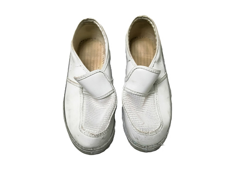 White esd shoes that have been used  Dirty joint, white background, isolated