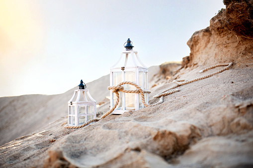 Beautiful wooden lantern on the sand mountain
