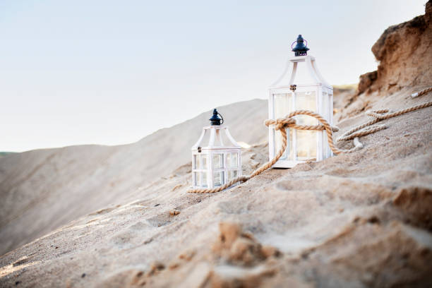 Beautiful wooden lantern on the sand mountain