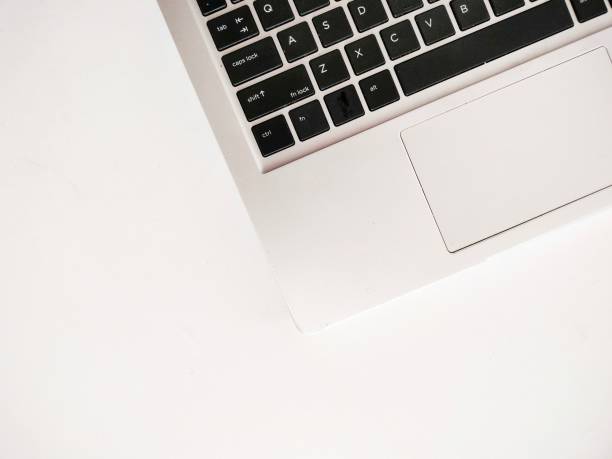 istock laptop keyboard and touchpad photographed from above on a white background 1924711065