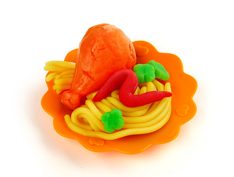Isolated playdough food on the plastic dish toy