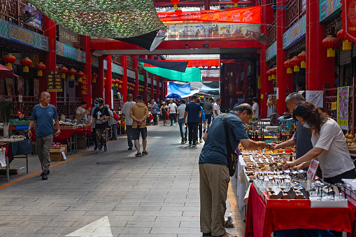 Jinan, Shandong, China -  26 June 2023:  People in famouns chinese culture market in Jinan center