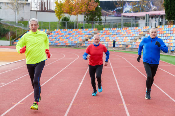 istock Elderly Runners in Action on Outdoor Track 1924757198
