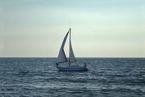Sailing with sailboat. Long exposure.