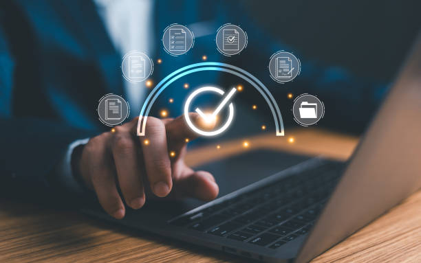 istock Businessman using laptop with correct sign mark and document icon for online approve paperless and quality assurance concept. 1924764795