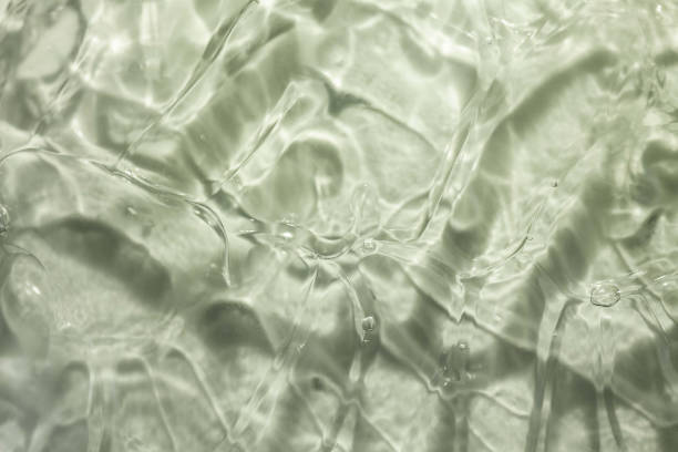 istock Light gray transparent water cosmetic texture. Gel smudge swatch on background. 1924775694