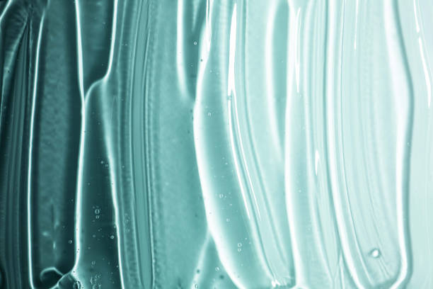 istock Light blue turquoise green aqua cosmetic texture. Gel smudge swatch on background. 1924778358