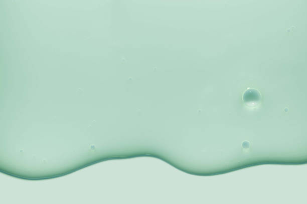 istock Light blue turquoise green aqua cosmetic texture. Gel smudge swatch on background. 1924779370