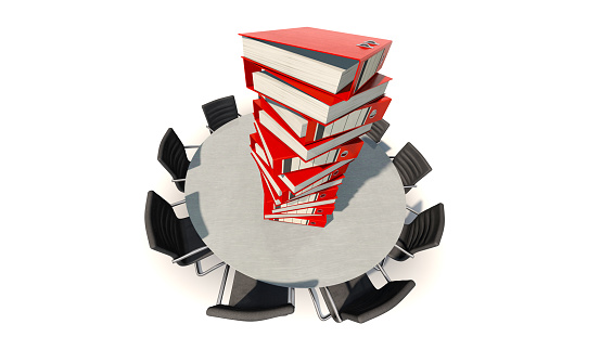 Symbolic image: A high stack of files on the table