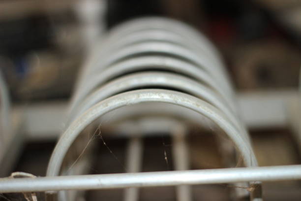 Dish drying metal rack with large clean white plates